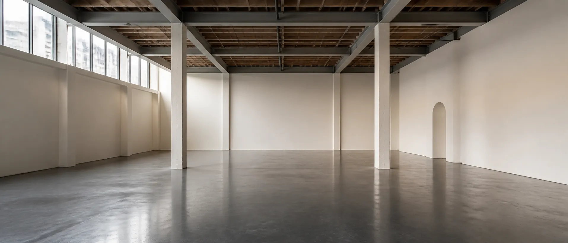 Empty daylight exhibition space used as the immutable source for a Grok Imagine editing workflow